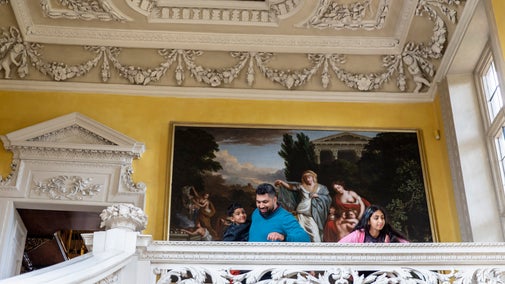 Family admiring the Great Stairs at Sudbury Hall